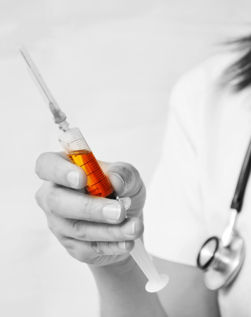 Nurse filling the syringeの写真素材