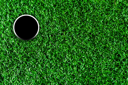 Golf course hole with artificial grass.の写真素材