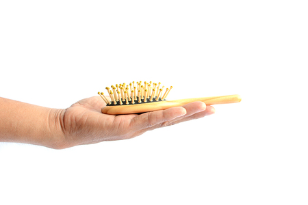 Hair loss, hair fall everyday serious problem, on white background.の写真素材