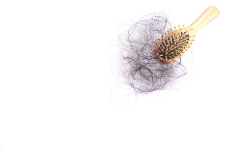 Hair loss, hair fall everyday serious problem, girl with a comb and problem hair.の写真素材