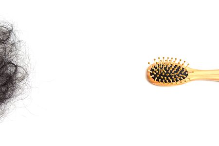 Hair loss, hair fall everyday serious problem, girl with a comb and problem hair.の写真素材