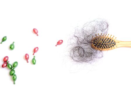 Hair loss, hair fall everyday serious problem, girl with a comb and problem hair.の写真素材