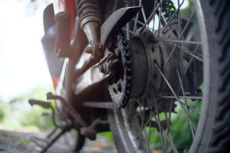 Close up details of the motorcycle chain from behindの写真素材