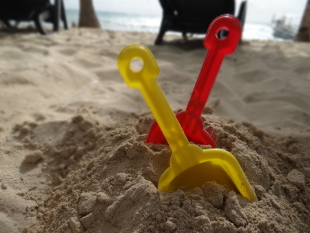 Toys in sandの写真素材