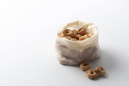 Health care is a good snack, a delicious snack in an ecological bag. On white backgroundの写真素材