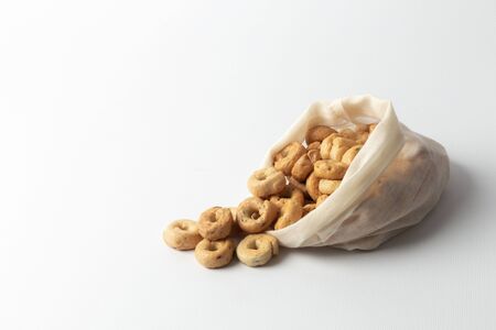 Health care is a good snack, a delicious snack in an ecological bag. On white background.の写真素材