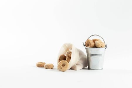 Small cooked snacks in an iron retro bucket. Proper nutrition. On white background.の写真素材