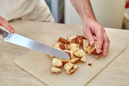 Preparation of croutons from the loaf.の写真素材