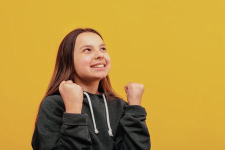 Joyful girl. The joy of victory. Look-up.