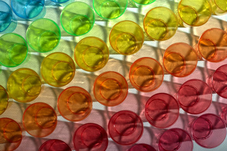 Beautiful bright texture of multicolored glasses. Nice background. Recycled plastic. Caring for the...