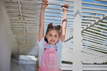 Portrait of a young beautiful girl on a bright sunny day. Cheerful contented girl. Summer day.