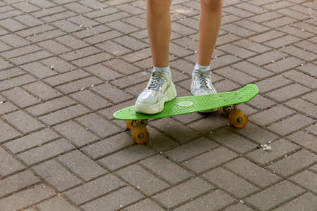Sports activities in nature skateboarding. Sports lifestyle. Summer holidays. Hot summer day.の写真素材