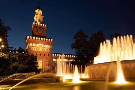 Beautiful view of Sforza Castle Castello Sforzesco with fountain at night, Milan, Italy. This old castle was built in 15th century by Francesco Sforza, Duke of Milano. Milan Italy 08.2020のeditorial素材