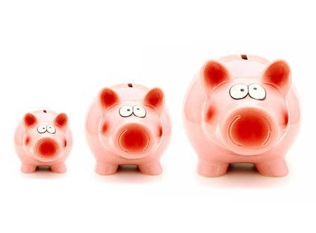Growing investment - three piggy banks of increasing size の写真素材