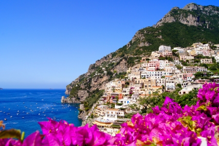 Panoramic view of Positano on the Amalfi Coast of Italy with beautiful flowers in the foregroundのeditorial素材