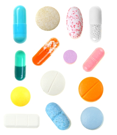 Group individually isolated pills over a white backgroundの写真素材