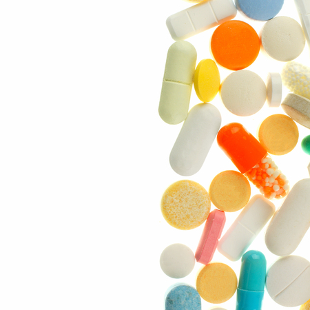 Vertical border of assorted medications isolated on whiteの写真素材