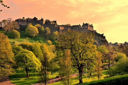 View of Edinburgh Castle and Princes Street Gardens at sunsetのeditorial素材