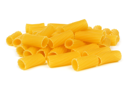 Pile of uncooked dry rigatoni pasta isolated on a white backgroundの写真素材