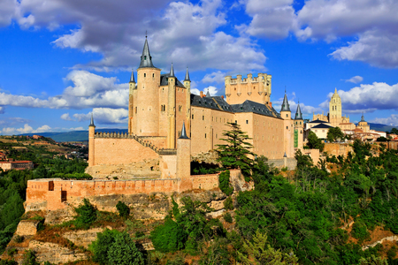 Beautiful Segovia Castle, Spain perched on a rocky hill with the old town behindのeditorial素材