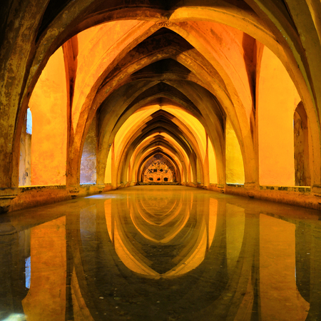 Royal baths at the Alcazar of Sevilla, Spain with reflectionsのeditorial素材