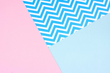 Pastel pink and blue paper texture abstract background. Angular arrangement with chevron pattern section.の写真素材