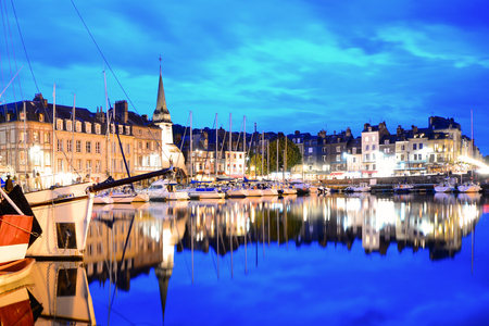 Picturesque Honfleur harbor at night with boats and reflections, Normandy, Franceの写真素材