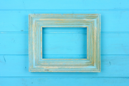 Empty rustic blue wooden frame against a blue wood background. Copy space.の写真素材