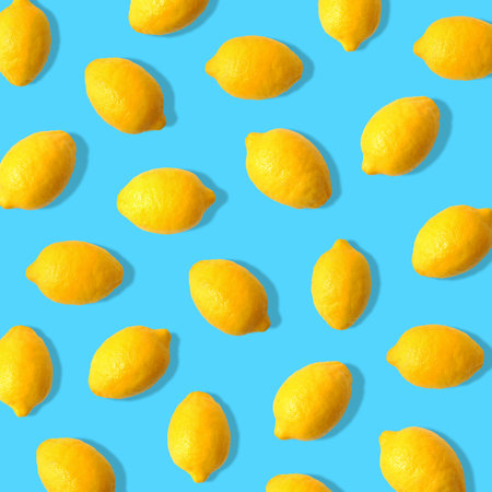 Summer fruit pattern of lemons on a bright blue