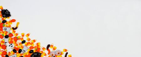 Halloween candy corner border banner on a white background with copy spaceの写真素材