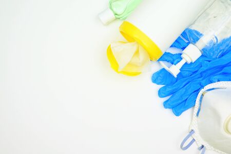 COVID 19 prevention equipment and sanitizers, top view corner border on a white background with copy spaceの写真素材