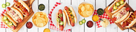 BBQ hot dog table scene banner, above view on white wood