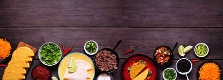 Taco bar bottom border with assorted ingredients.の写真素材