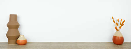 Home decor on a wood shelf against a white wall banner background. Fall color scheme vases and branches. Copy space.の写真素材