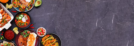 Mexican food corner border. Top view on a dark stone banner background. Tacos, burrito plate,...