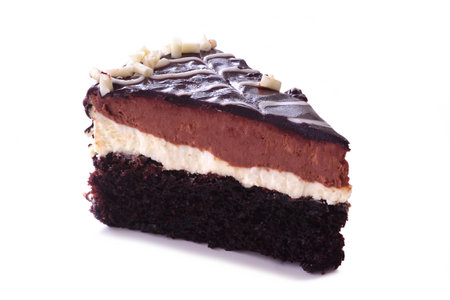 Truffle Royale cake slice isolated on a white background. Layer of rich chocolate cake, white chocolate truffle and dark chocolate truffle.の写真素材