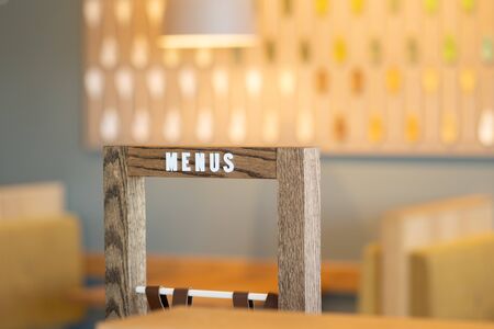 Menu sign rack in a modern coffee house with abstract backgroundの写真素材
