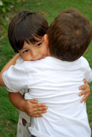 Two cute little boys hugging each otherの写真素材