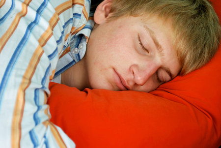 Young man sleepingの写真素材