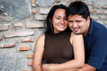 Happy Hispanic Couple Embracingの写真素材