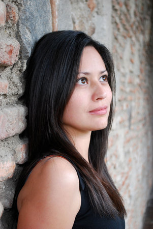 Beautiful Hispanic woman looking off into the distanceの写真素材