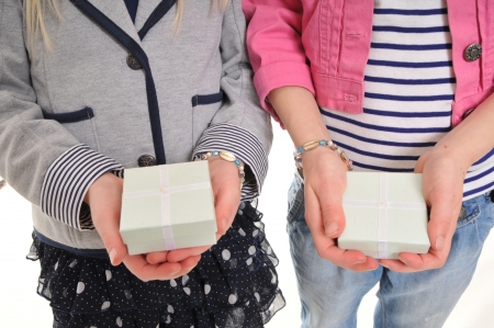 children holding presents in their hands isolated on whiteの写真素材