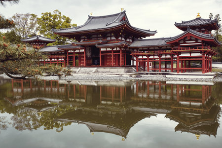 Byodoin temple reflecting against a pond in the town of Uji, Kyoto, Japanのeditorial素材