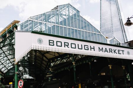 Entrance into the food hall, Borough Market in Southwark, London on a Summer dayのeditorial素材