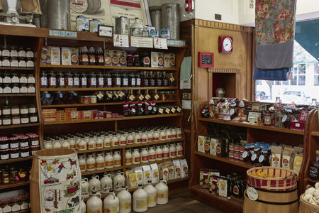 Woodstock, Vermont - September 30th, 2019: Variety of New England maple syrup for sale at a general...