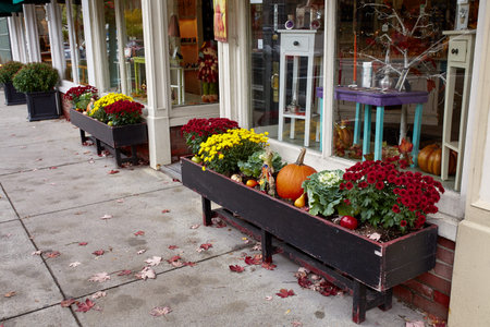 Woodstock, Vermont - September 30th, 2019:  Small shops and restaurants decorated with Fall pumpkins...