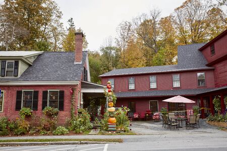 Woodstock, Vermont - September 30th, 2019:  Small shops and restaurants decorated with Fall pumpkins in the historic New England town of Woodstock.のeditorial素材