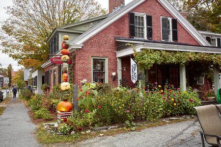 Woodstock, Vermont - September 30th, 2019:  Small shops and restaurants decorated with Fall pumpkins in the historic New England town of Woodstock.のeditorial素材