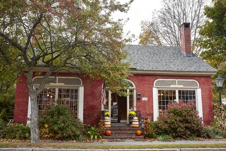 Woodstock, Vermont - September 30th, 2019:  Small shops and restaurants decorated with Fall pumpkins in the historic New England town of Woodstock.のeditorial素材