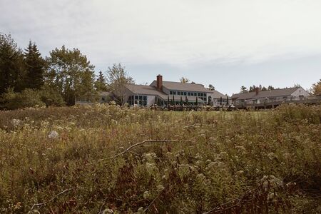 Mount Desert Island, Maine - September 28th, 2019:  Field with view of Jordan Pond House restaurant in the distance at Acadia National Park in Mount Desert Island, Maine.のeditorial素材